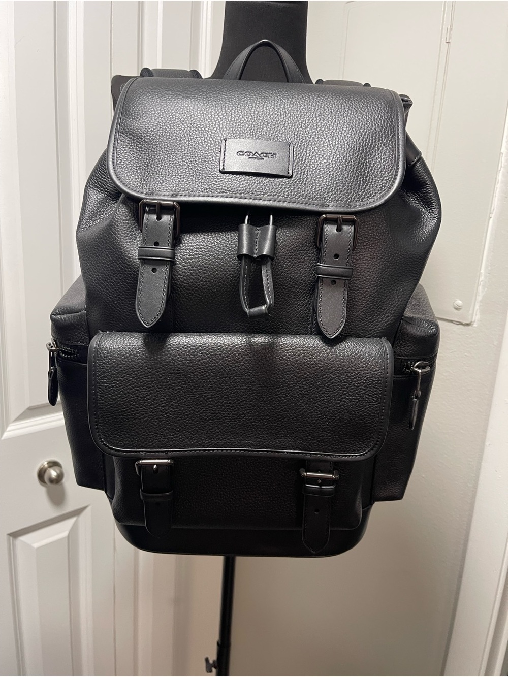 Coach Black Pebbled Leather Buckle-Front Backpack